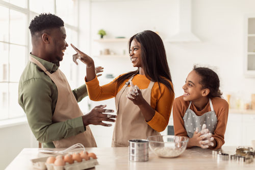 happy-black-family-baking-having-fun-with-dough