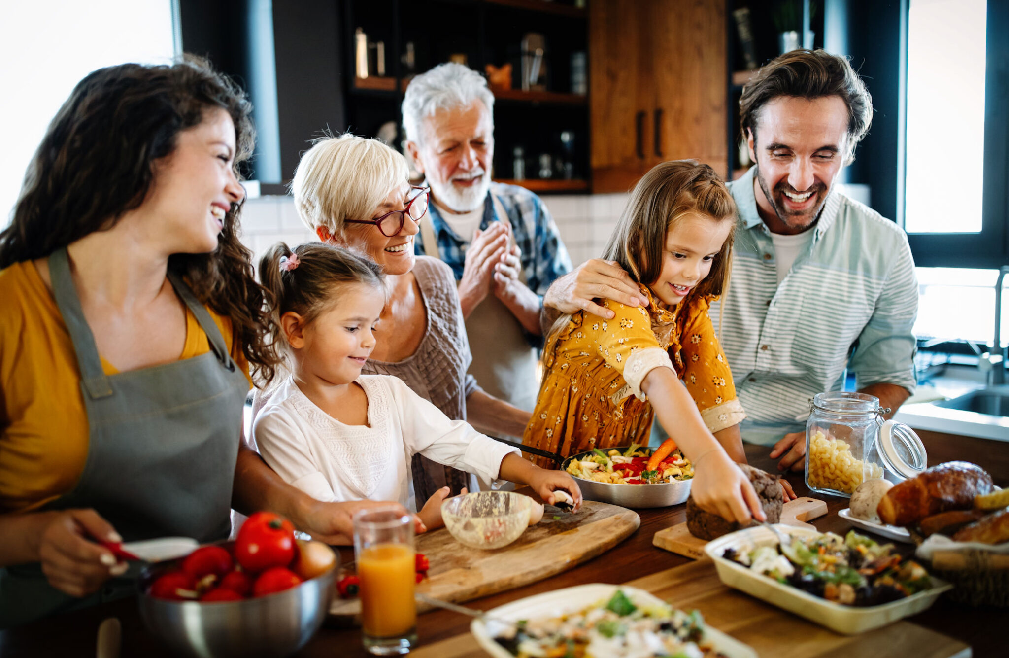 Portrait of happy family cooking in kitchen at home Portrait of happy family