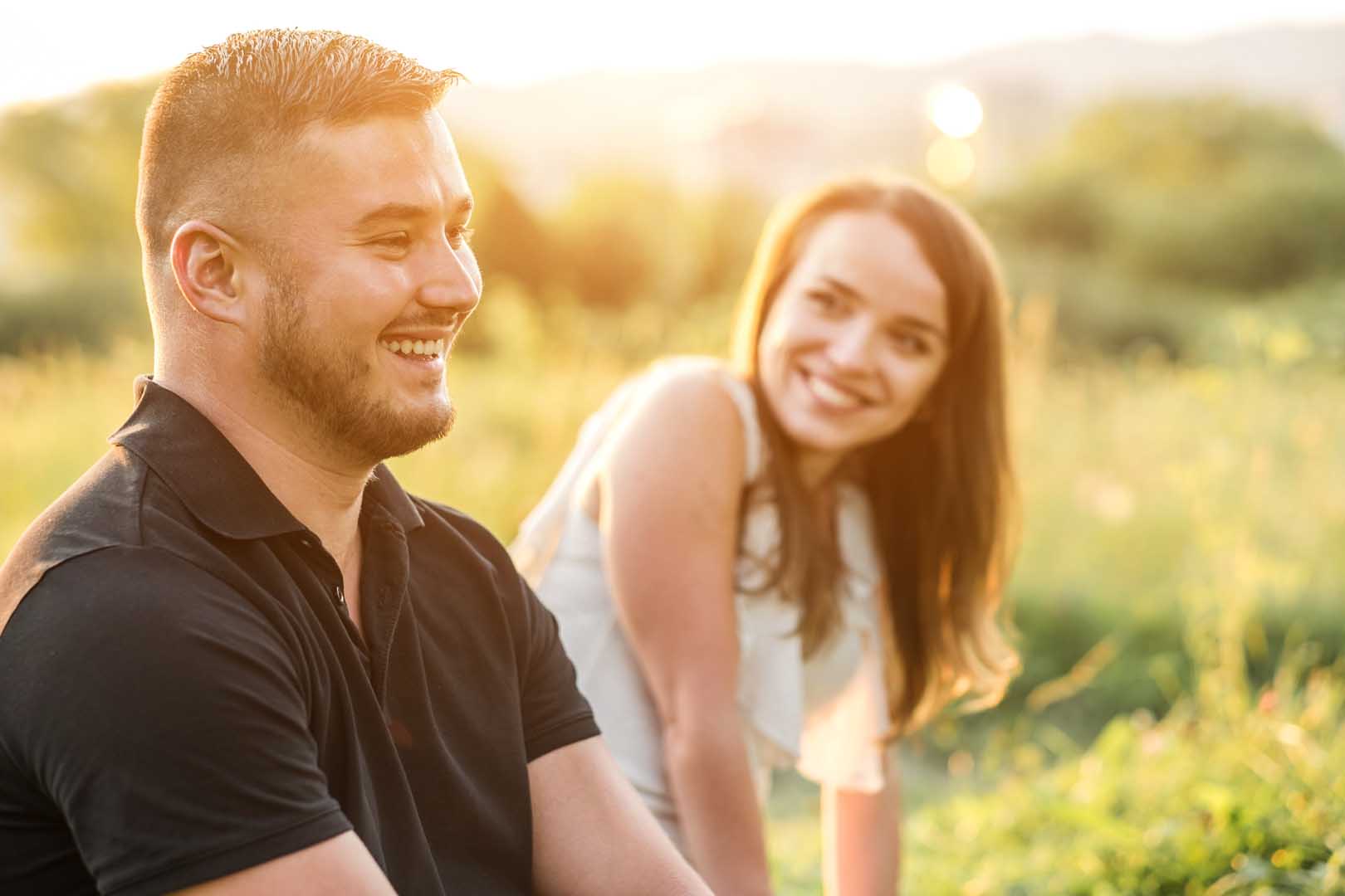 Couple,Lovers,Hugging,And,Kissing,In,The,Park,At,Sunset.